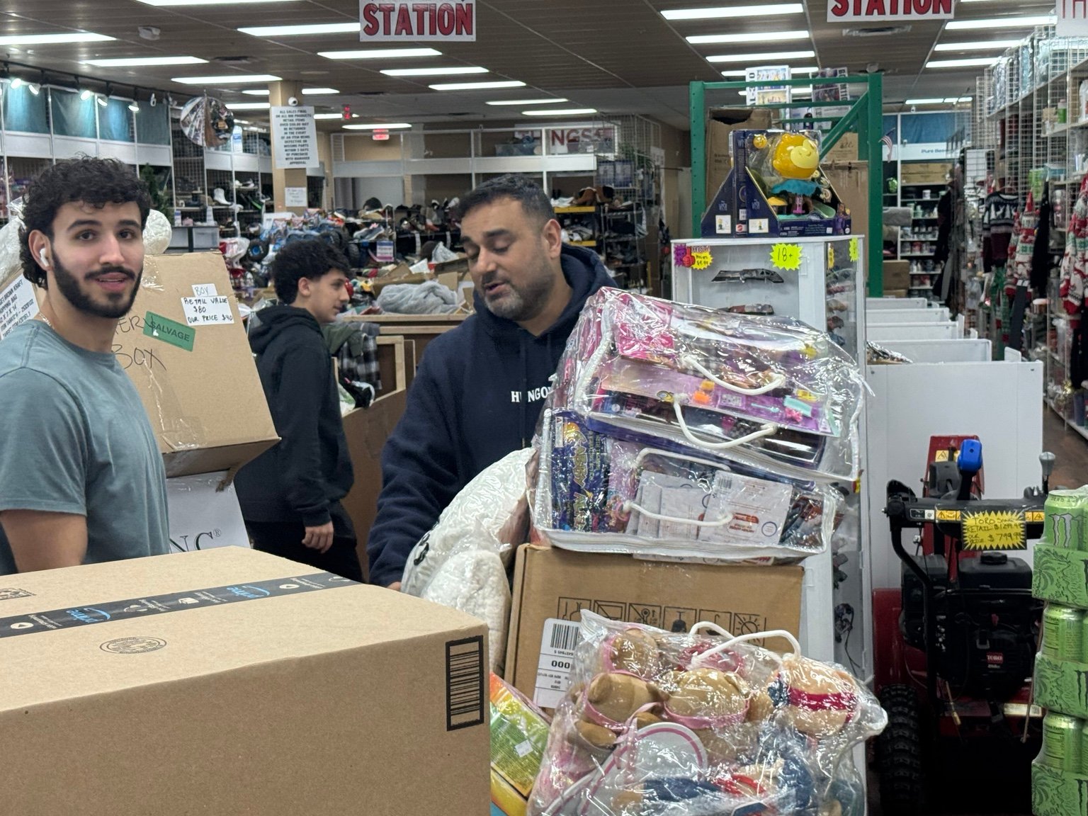 Volunteers collecting boxes of supplies together
